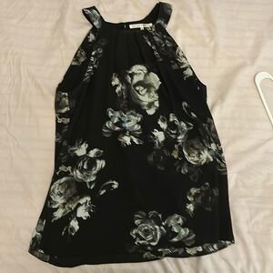 Floral blouse. Black with white floral pattern with light blue accent color